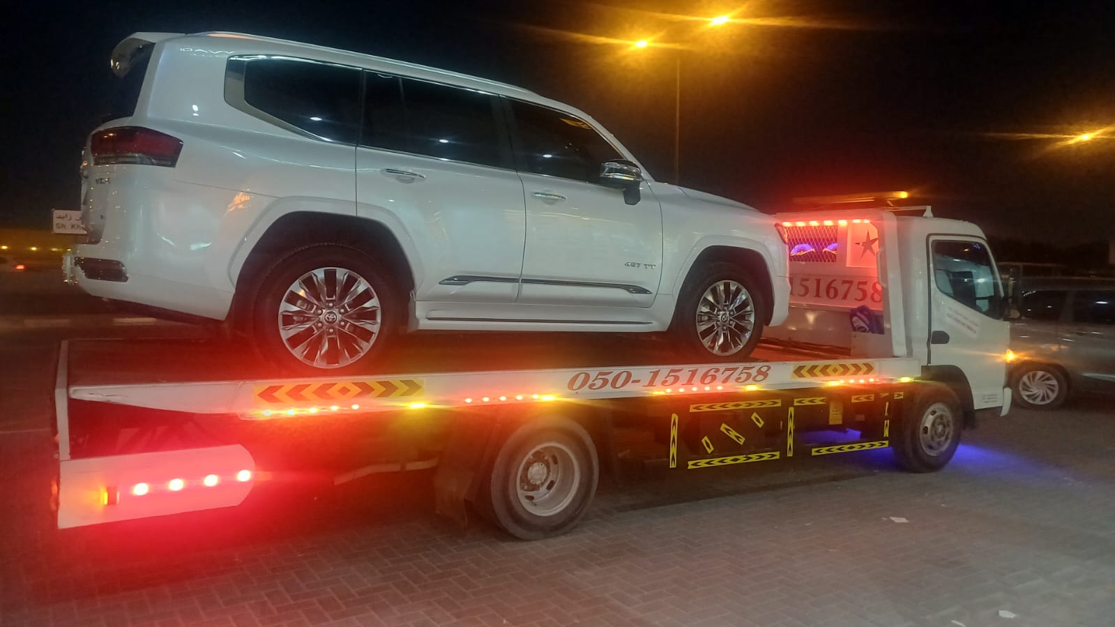 White Nissan Patrol Heavy SUV towing